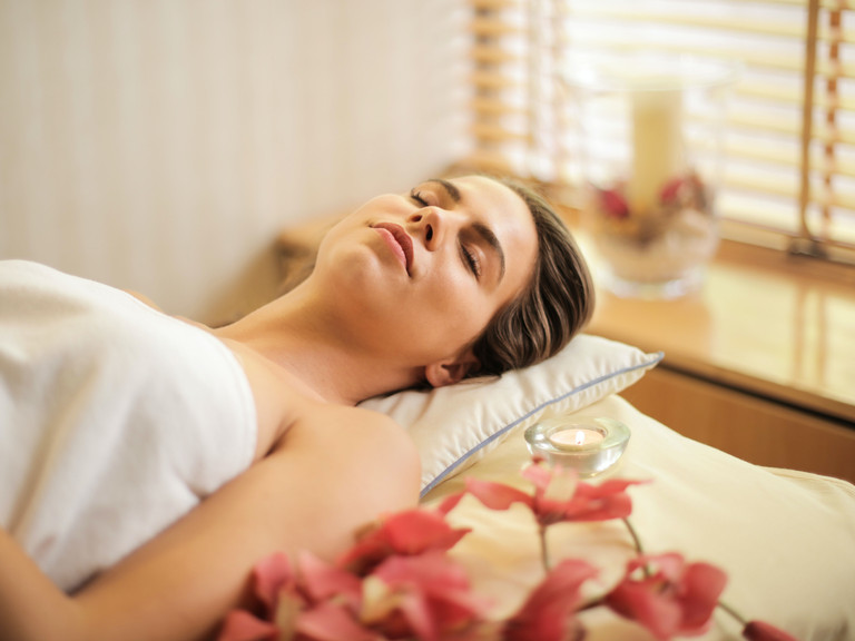 woman-in-wrapped-in-white-towel-lying-on-bed-with-eyes-3757942.jpg